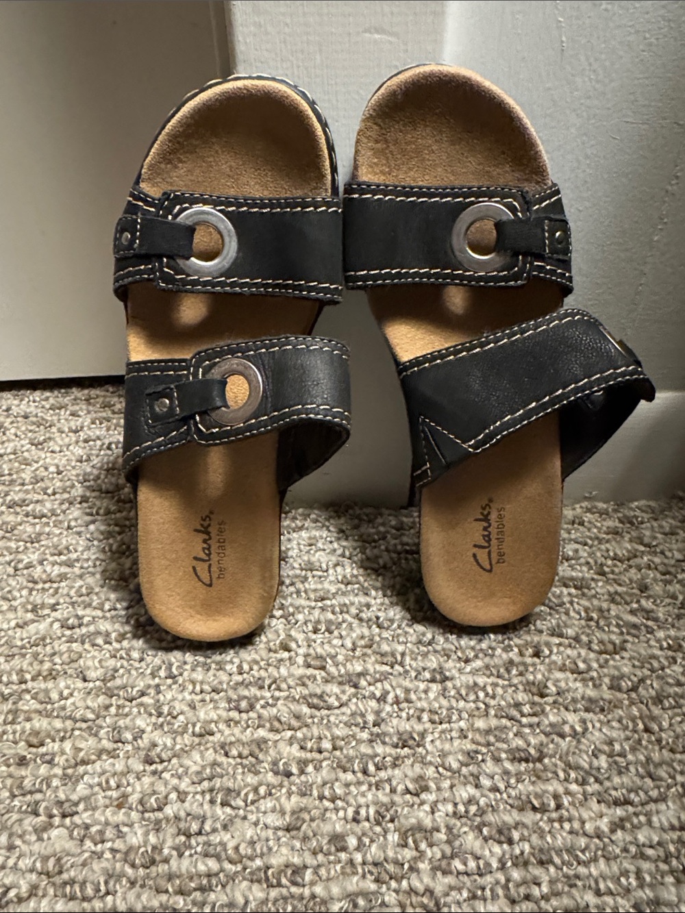Clarks Black Slide Sandals with Metal Eyelet Accents